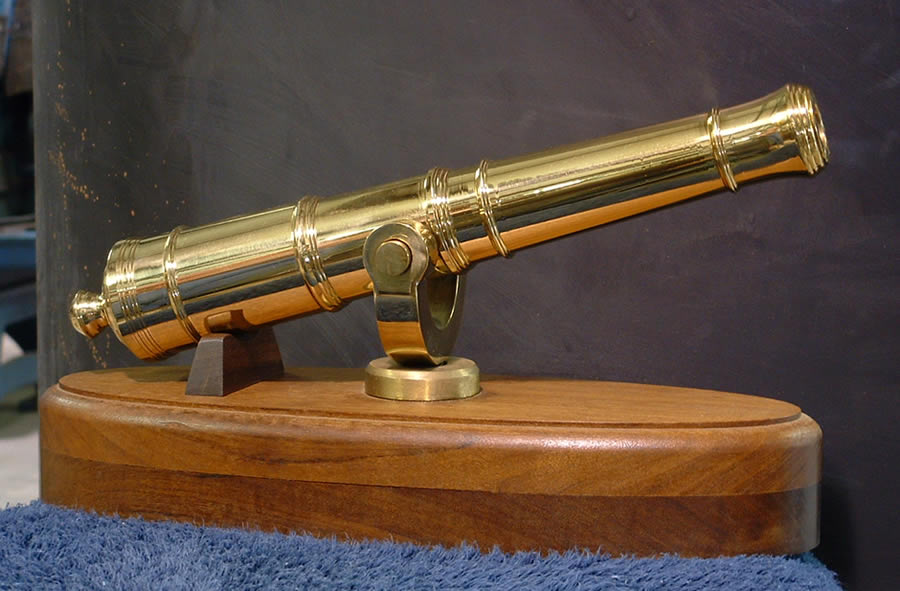 B.N.A. swivel gun in wooden base